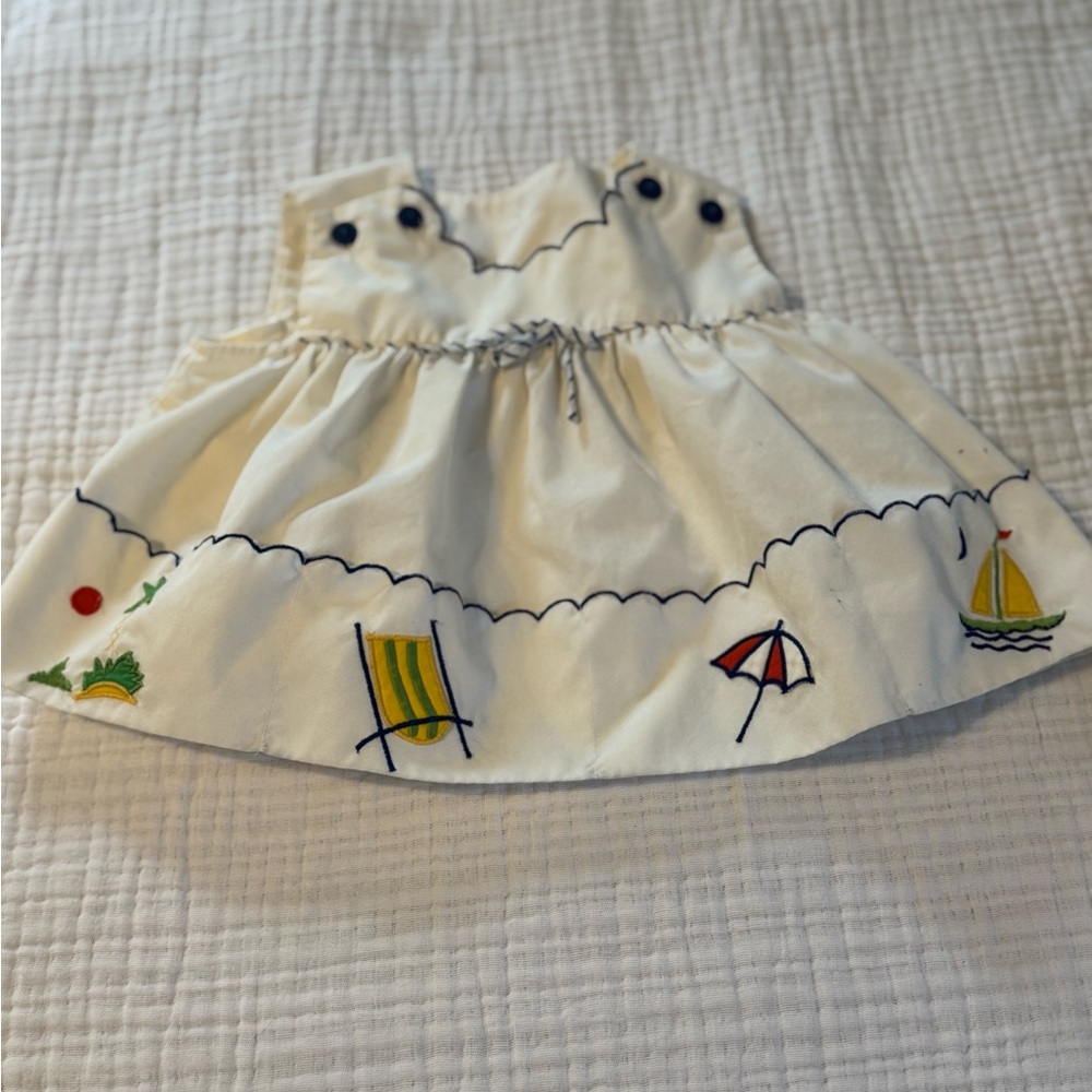 Vintage 1970 era baby dress. White with nautical accents.